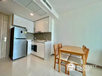 Modern kitchen with dining area in sleek apartment