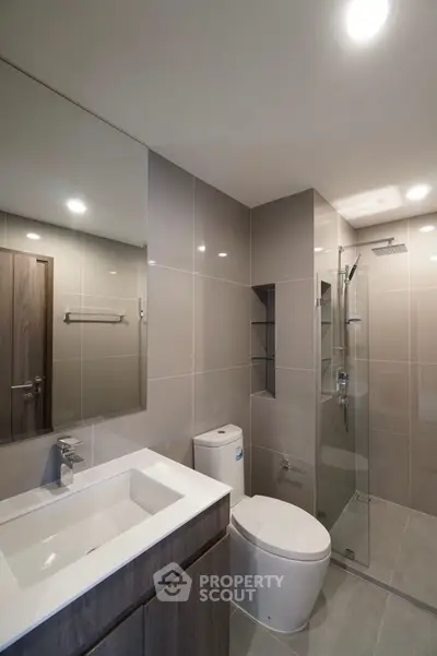 Modern bathroom with sleek design and glass shower enclosure