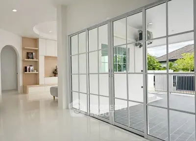 Modern living room with sliding glass doors and outdoor view
