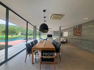 Luxurious open-plan living and dining area with stunning views and modern design.
