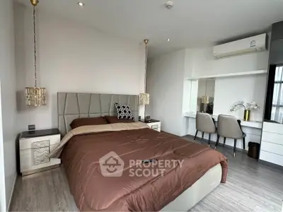 Luxurious modern bedroom with elegant decor and workspace