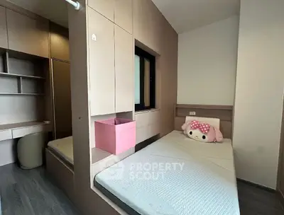 Cozy bedroom with built-in storage and charming decor