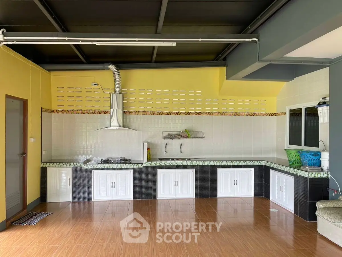 Spacious kitchen with modern design and ample storage space