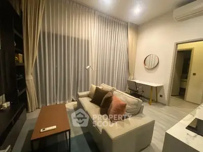 Modern living room with cozy sofa, stylish decor, and ambient lighting