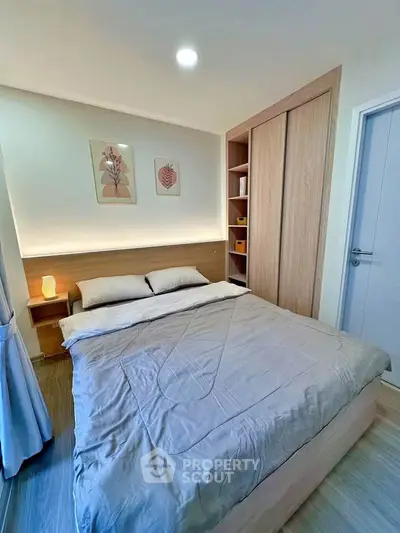 Cozy modern bedroom with stylish decor and ample storage space