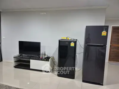 Modern living room with sleek appliances and minimalist design