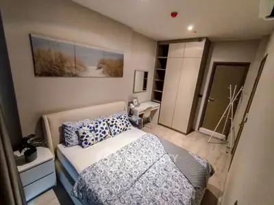 Cozy modern bedroom with stylish decor and ample storage space