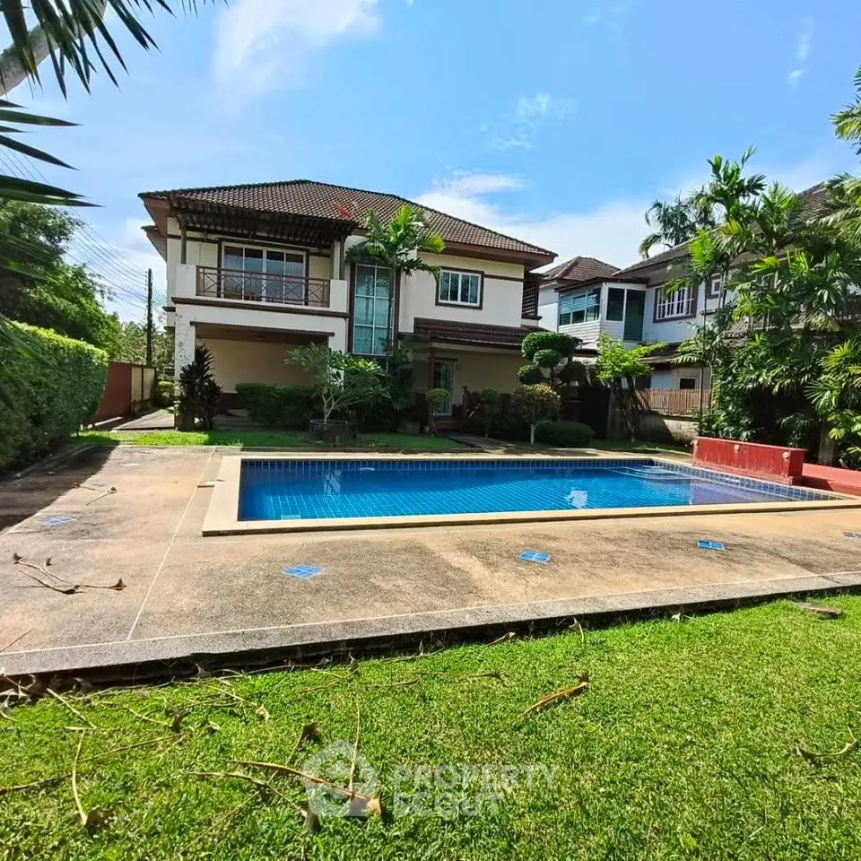 Luxurious home with private pool and lush garden in a serene neighborhood.