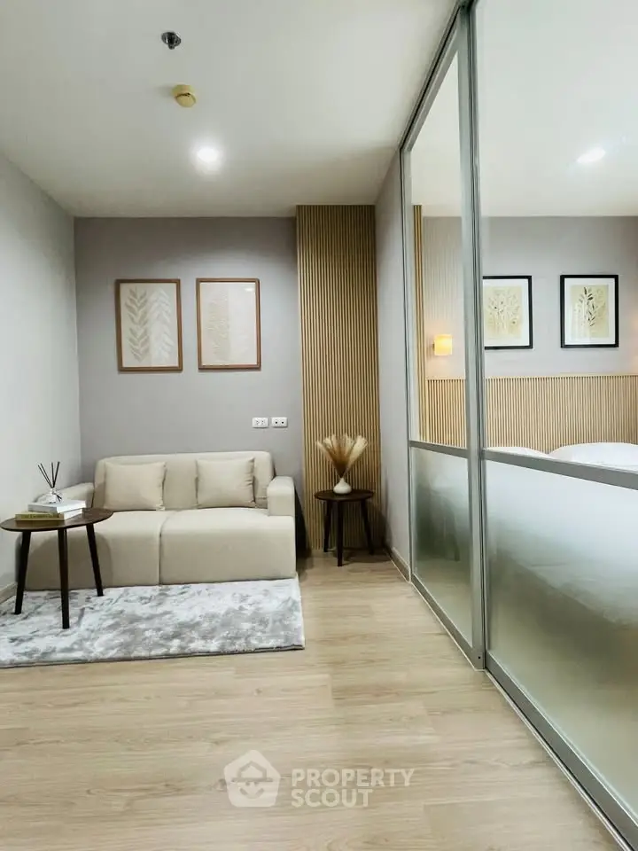 Modern living room with cozy sofa and stylish decor in a contemporary apartment.