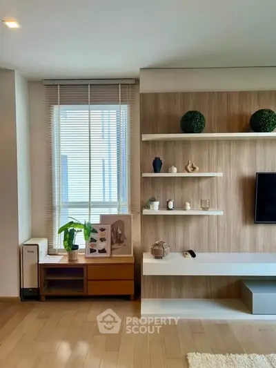 Modern living room with stylish shelving and natural light