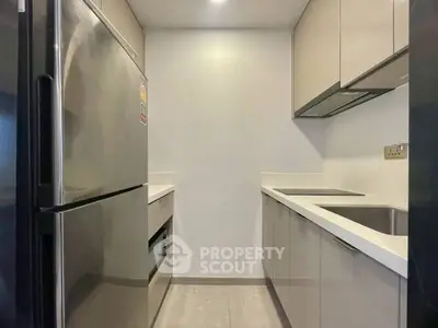 Modern kitchen with sleek cabinetry and stainless steel appliances
