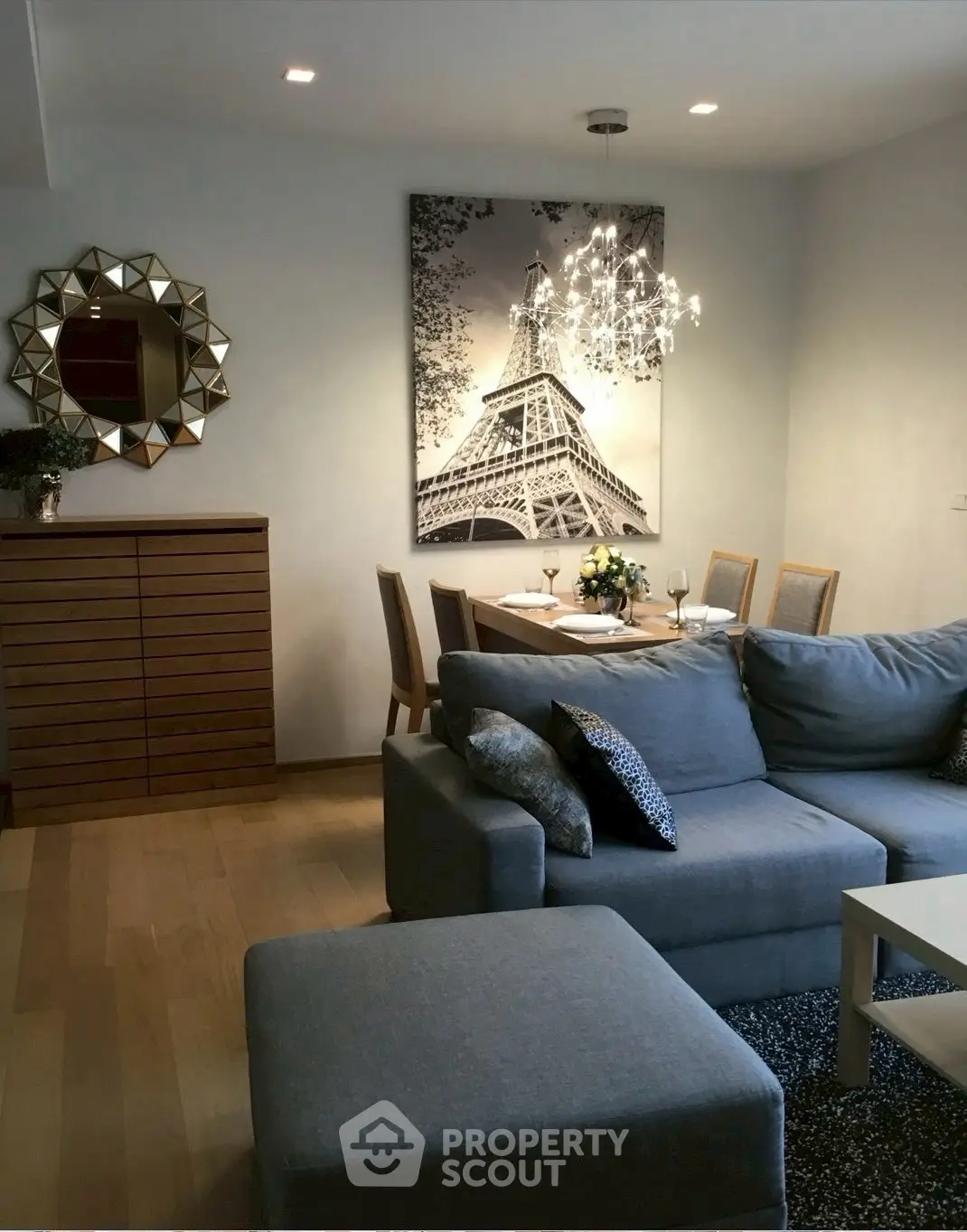 Stylish living room with modern decor and cozy seating area, perfect for relaxation and entertaining.
