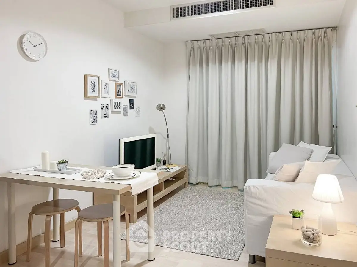 Charming minimalist living room with cozy seating and stylish decor