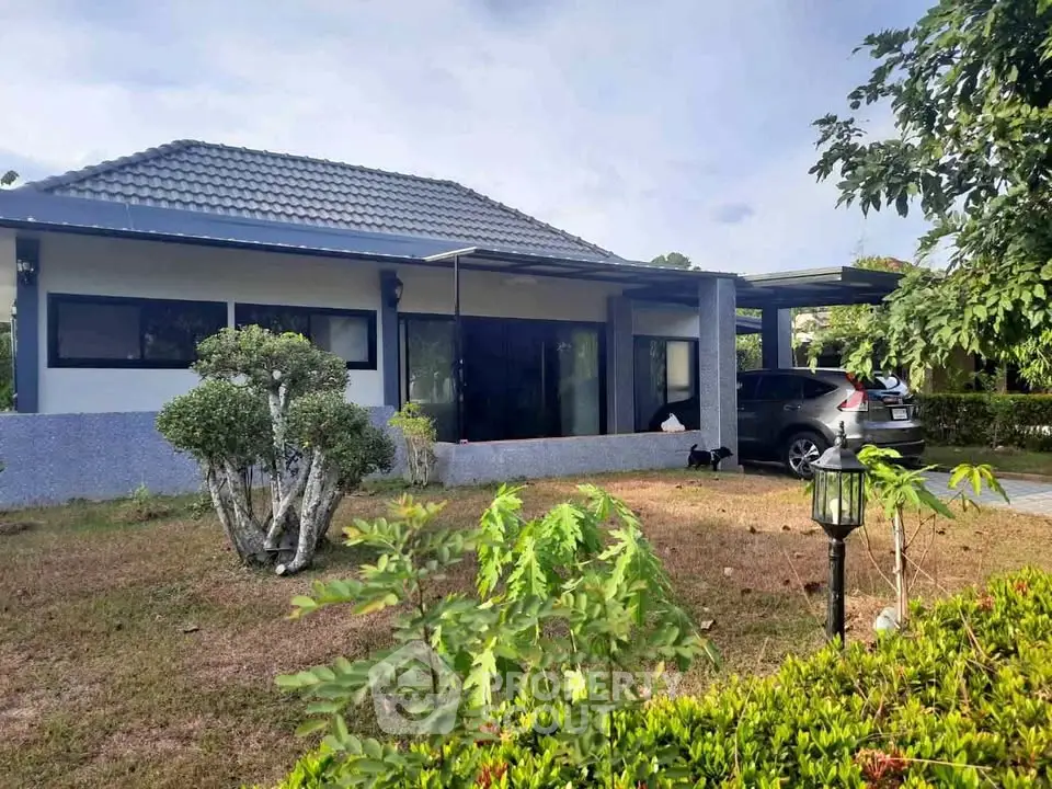 Charming single-story home with modern design and spacious garden area.