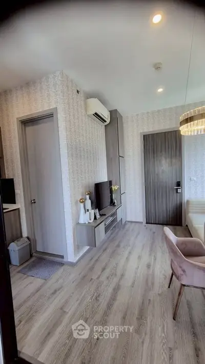 Modern living room with stylish decor and wooden flooring