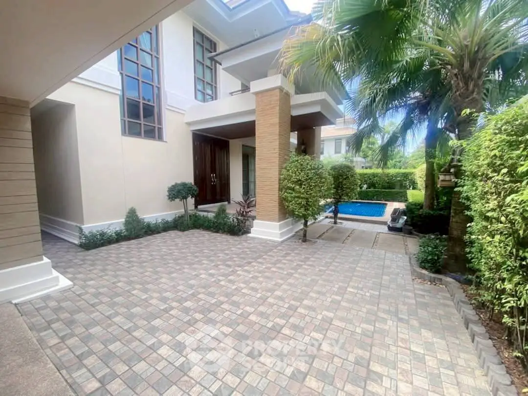 Luxurious modern home with private pool and lush garden, perfect for serene living.
