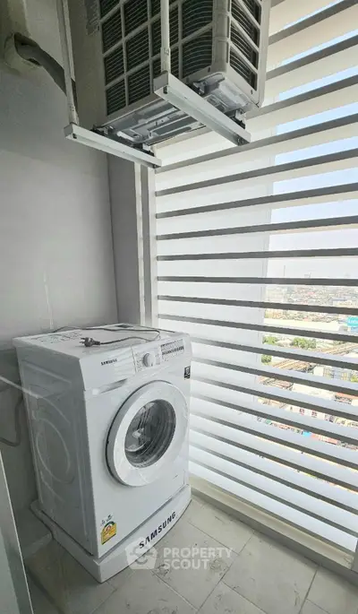Modern apartment balcony with Samsung washing machine and city view