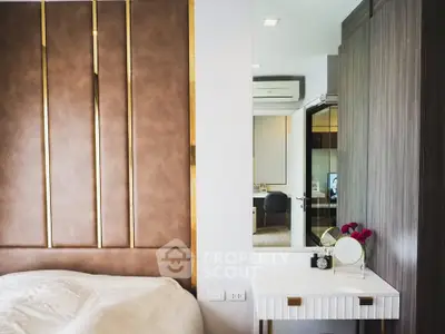 Luxurious bedroom with elegant decor and modern furnishings in a stylish apartment.
