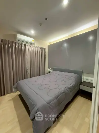 Modern bedroom with sleek design and cozy ambiance, featuring a comfortable bed and stylish curtains.