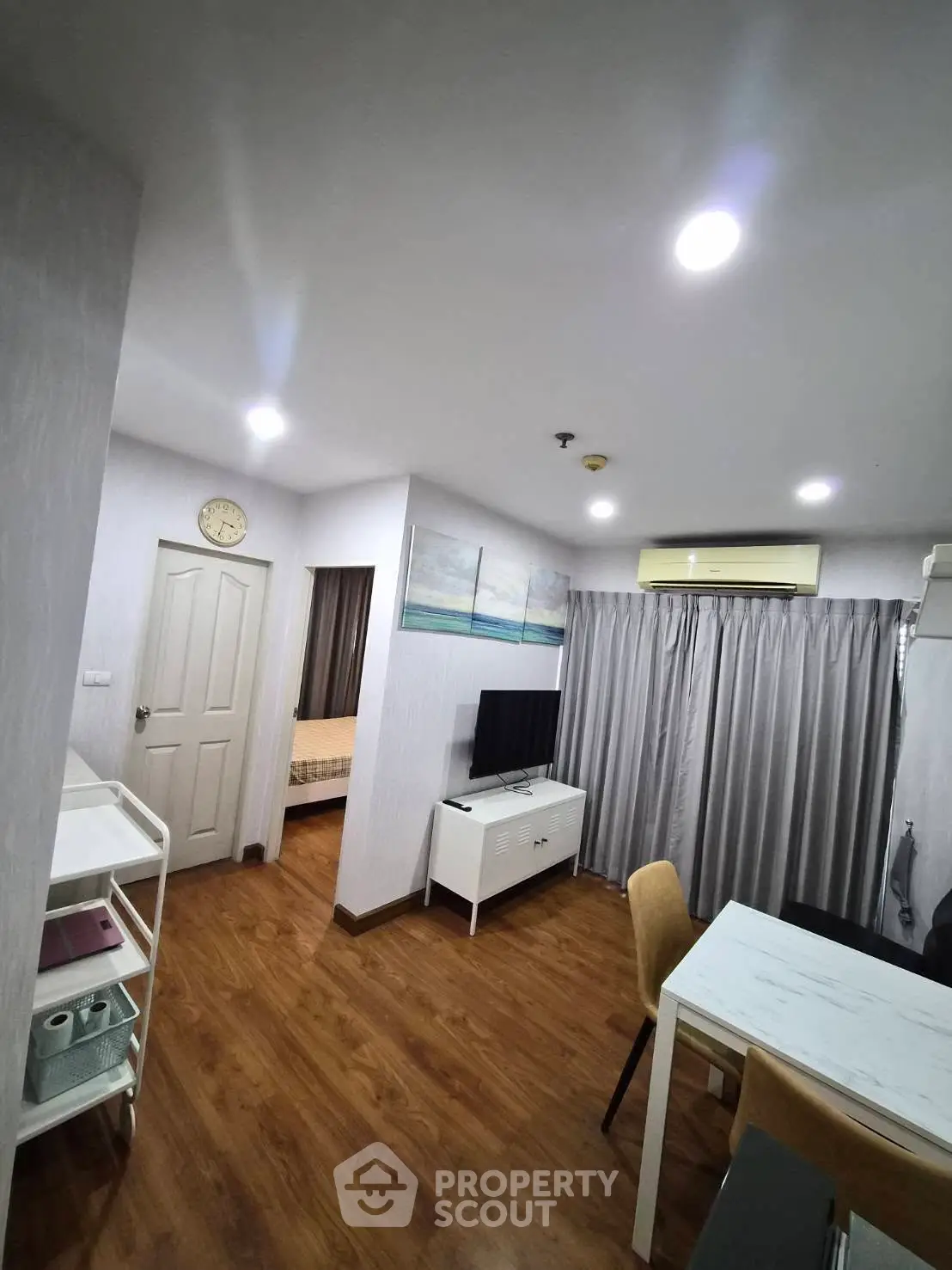 Modern apartment interior with wooden flooring and stylish decor