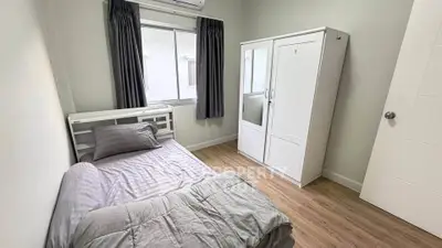 Cozy bedroom with modern furnishings and natural light