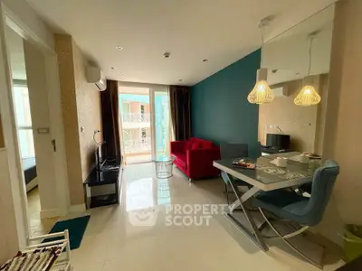 Modern living room with vibrant decor and balcony access