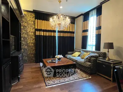 Luxurious living room with elegant chandelier and stylish decor