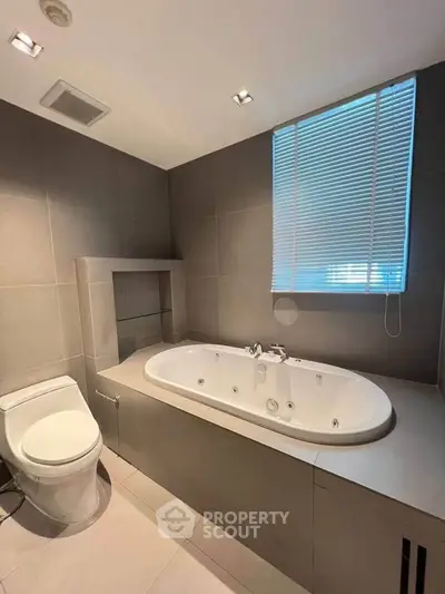Luxurious bathroom with modern bathtub and sleek design, perfect for relaxation and comfort.