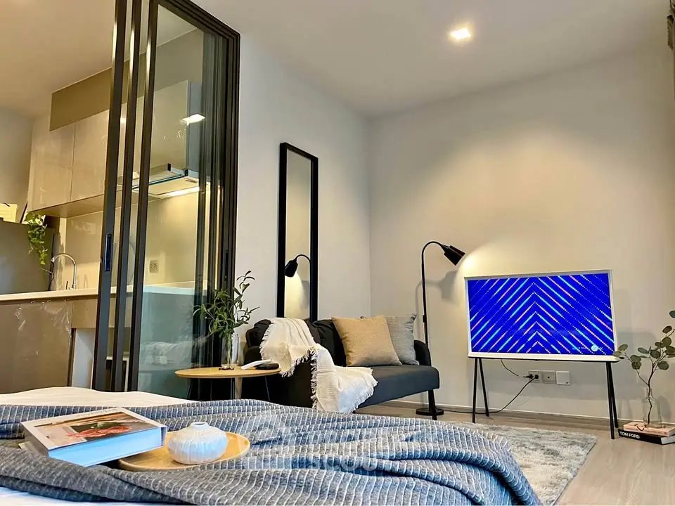 Modern living room with stylish decor and open kitchen layout