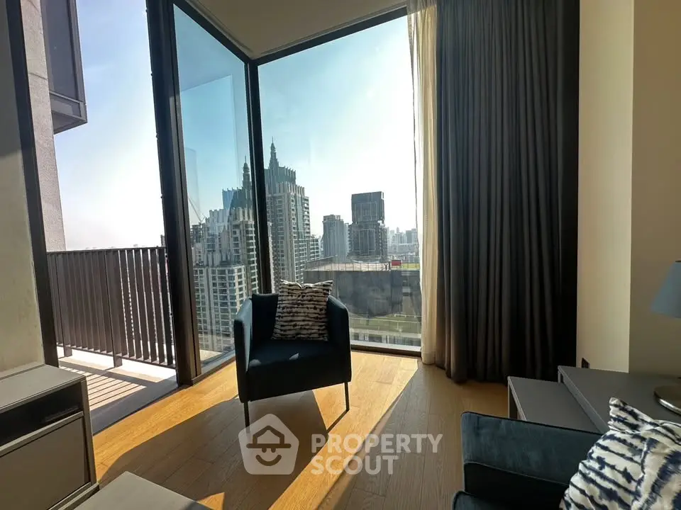 Modern living room with floor-to-ceiling windows offering stunning city views and elegant furnishings.