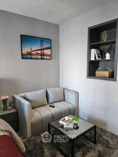 Cozy living room with modern decor and plush sofa, perfect for relaxation.