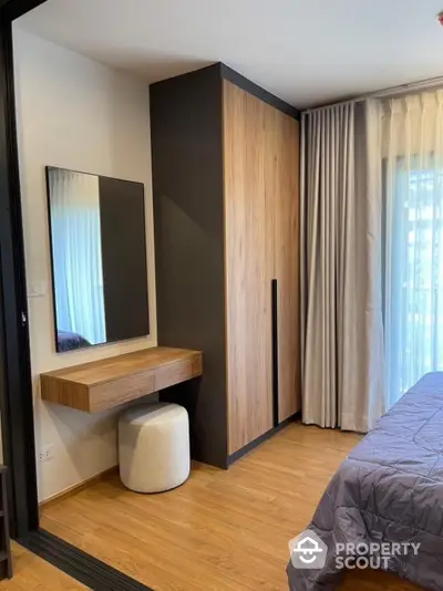 Modern bedroom with wooden wardrobe and stylish dressing table