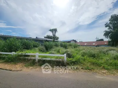 Spacious plot with lush greenery and potential for development in a serene neighborhood.