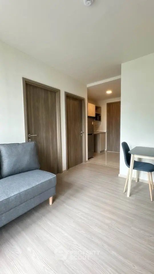 Modern apartment interior with cozy living area and sleek kitchen design