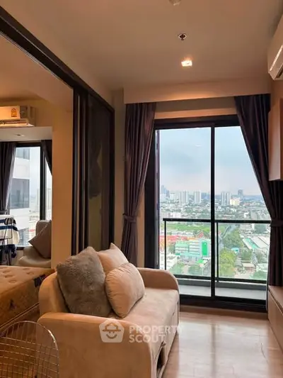 Modern living room with city view and cozy sofa in high-rise apartment