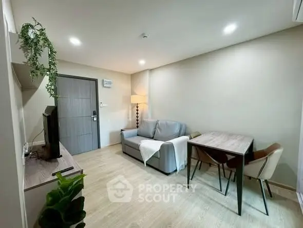 Modern living room with cozy sofa and dining area in stylish apartment