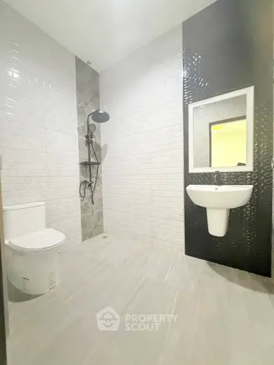 Modern bathroom with sleek tiles and contemporary fixtures