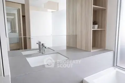 Modern bathroom with sleek double sinks and minimalist design