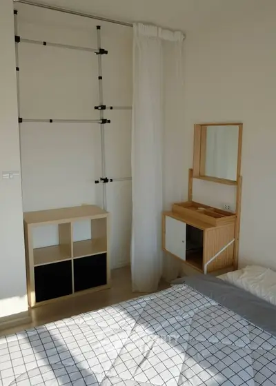 Bright bedroom with minimalist furniture and natural light