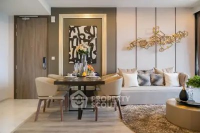 Stylish modern living room with elegant decor and dining area, featuring contemporary art and plush seating.