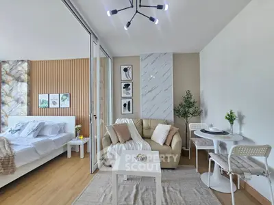 Modern studio apartment with stylish decor, featuring a cozy living area, dining space, and elegant bedroom.
