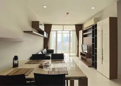 Modern living room with city view, sleek furniture, and open layout for stylish urban living.