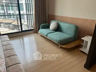Modern living room with stylish sofa and large window view