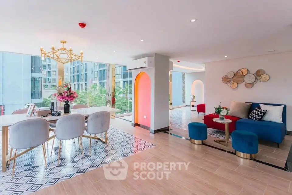 Luxurious open-plan living and dining area with modern decor and large windows offering stunning views.