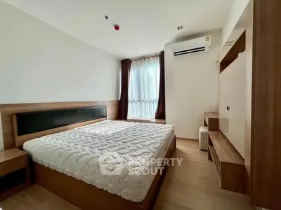 Modern bedroom with stylish wooden furniture and natural light