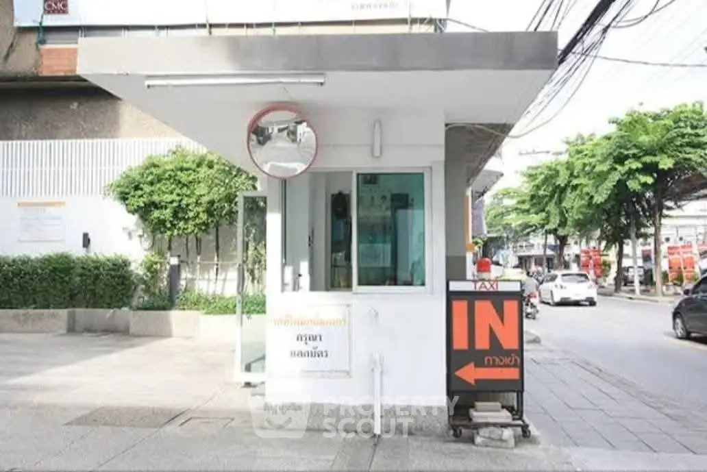 Modern security booth at property entrance with street view