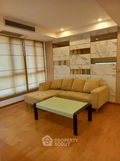 Spacious living room with modern decor and natural light