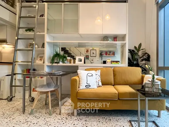 Modern living room with stylish yellow sofa and loft storage, featuring chic decor and natural light.
