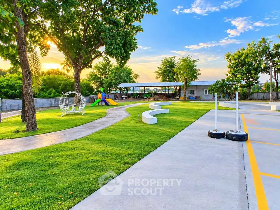 Spacious outdoor garden with seating and playground, perfect for family gatherings.