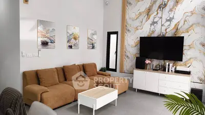 Modern living room with stylish decor, featuring a brown sofa, marble accent wall, and sleek entertainment center.